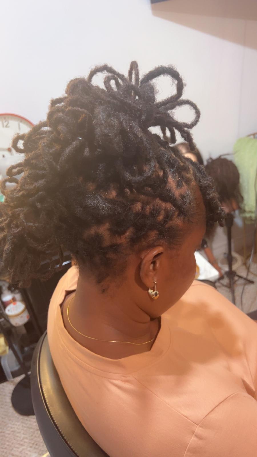 Loc pineapple updo with barrel curls