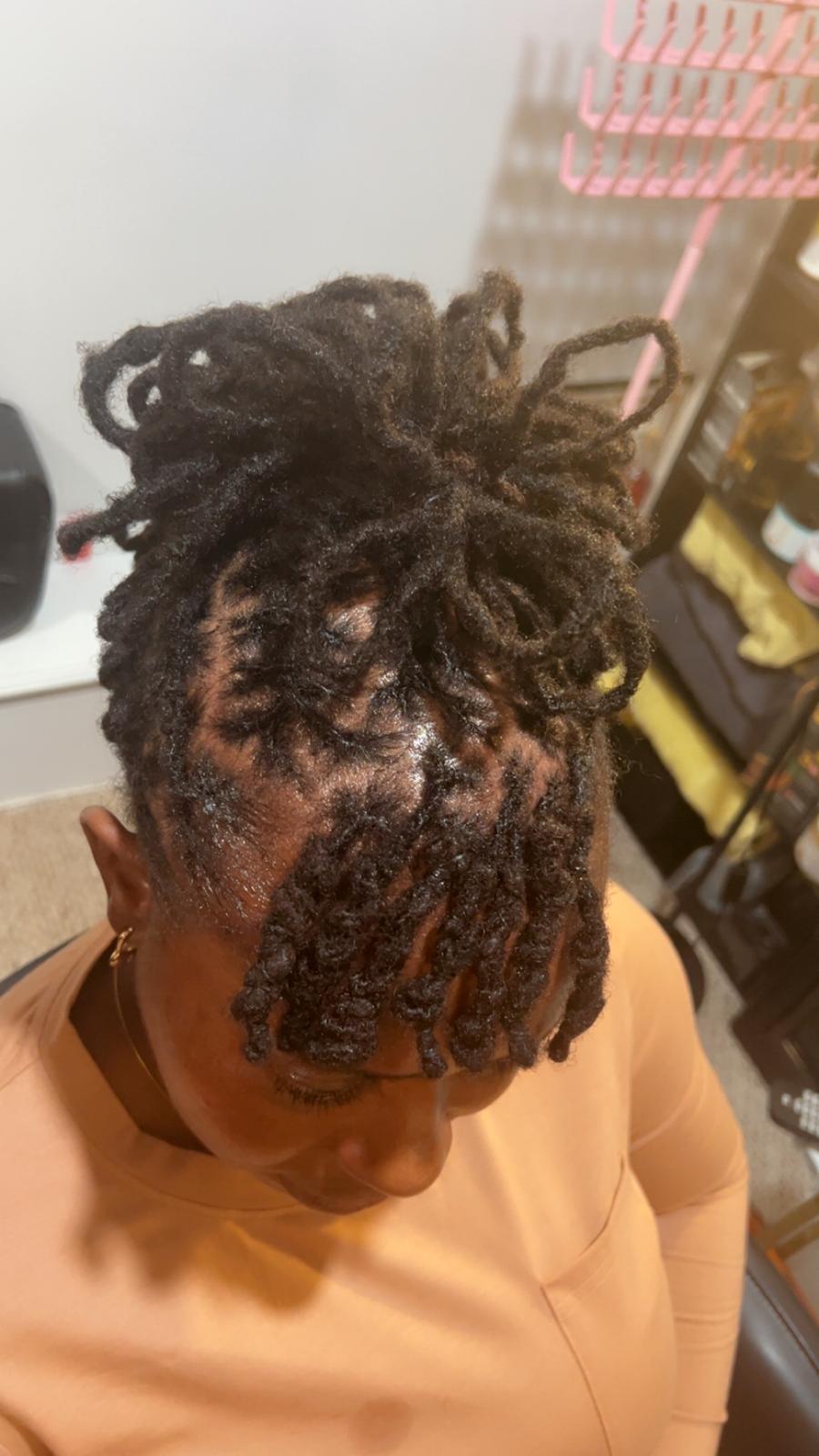 Interlocked starter locs with a curly top