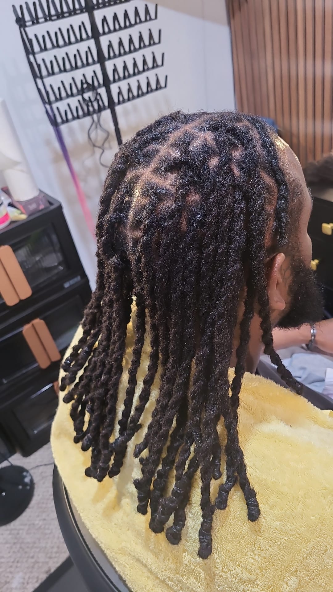 Men's locs retwisted and styled